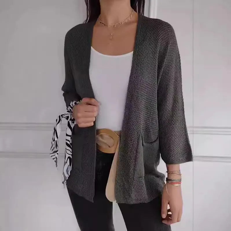 Women's waffle texture cardigan coat in army green with nine-quarter length sleeves and pockets.