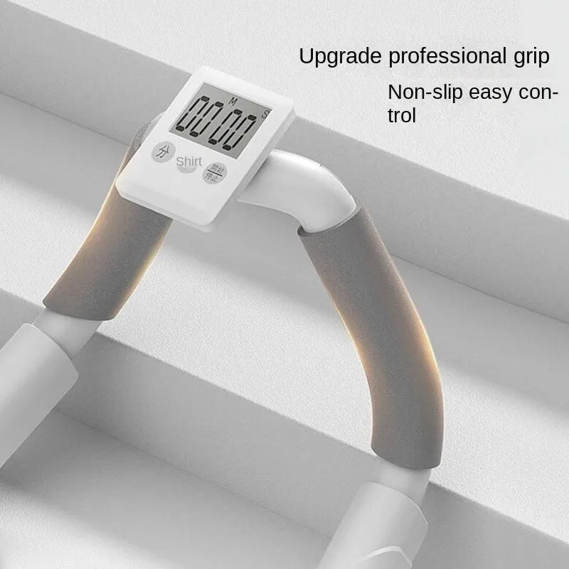 Grey push up fitness board with flat support trainer and LCD display on a floor