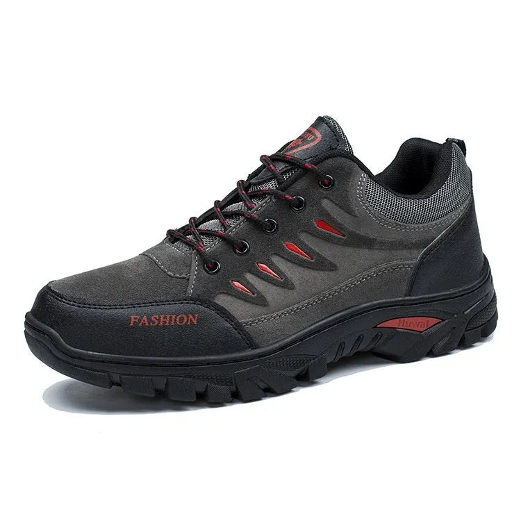 Men's brown suede hiking shoes with rubber sole and lace-up closure, showing round toe and mid-top design