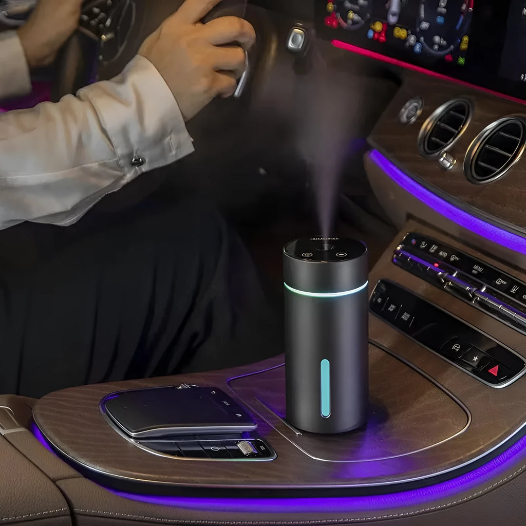Aluminium portable car air humidifier and essential oil diffuser with coloured night light on.