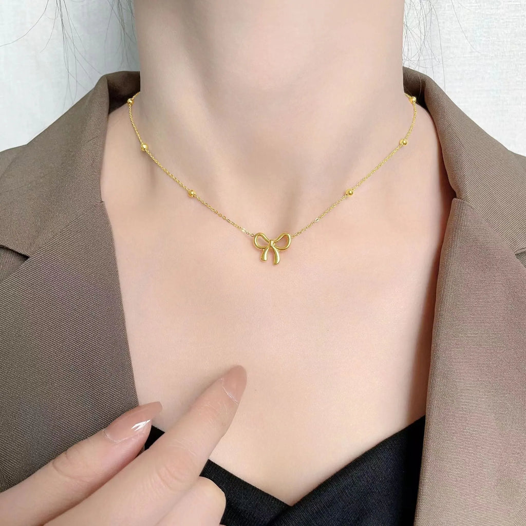 Gold bow necklace with titanium steel cross chain, adjustable length 41-50cm