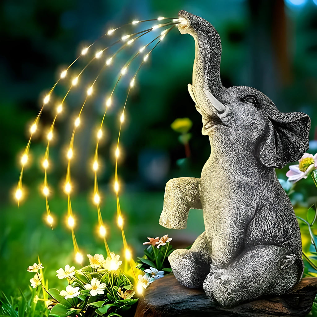 Resin elephant outdoor garden statue with built-in LED lighting strip.
