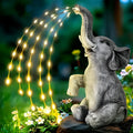 Resin elephant outdoor garden statue with built-in LED lighting strip.