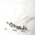 A bundle of white, tightly woven cotton candle wicks in varying lengths for DIY candle making.