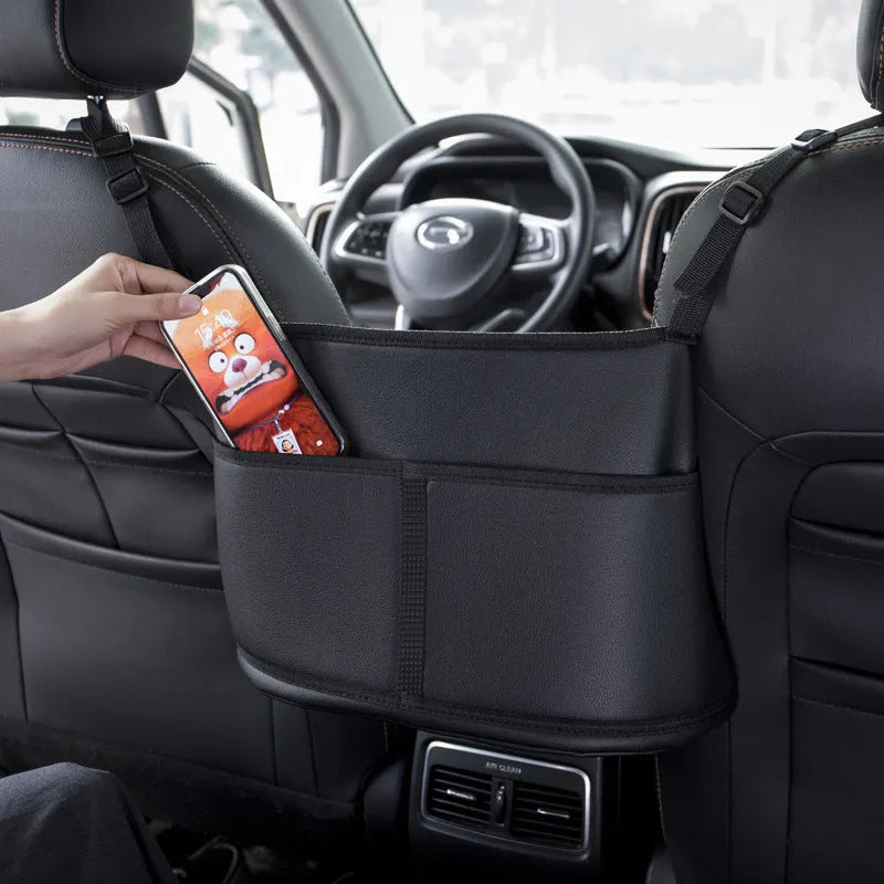 Black leather car seat net pocket storage bag measuring 38cm mounted between vehicle seats