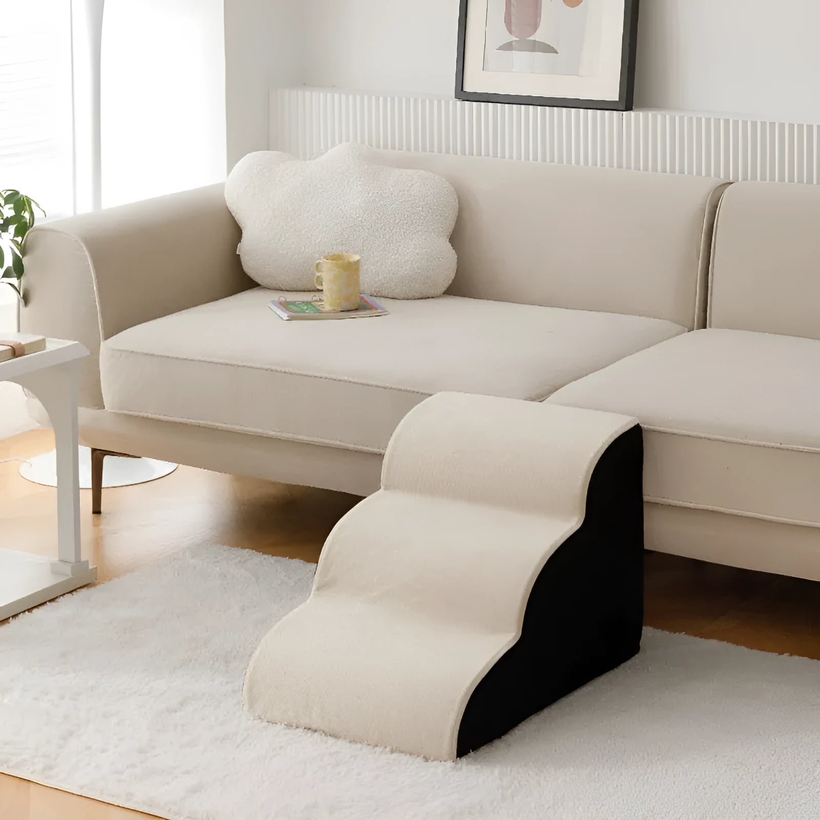 Brown wooden dog stairs with washable fabric cover next to a sofa