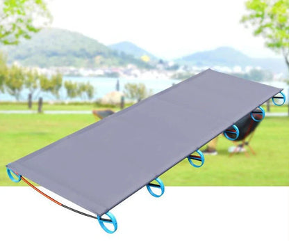 Grey aluminium camp bed folded to 41cm length with carrying bag