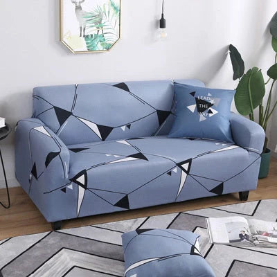 Printed stretchable sofa slipcover covering a three-seater sofa in a modern geometric pattern