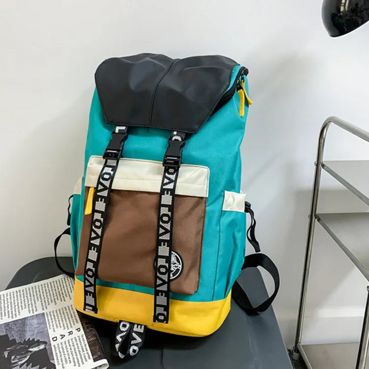 Black oxford cloth backpack with adjustable straps, shown next to green and red colour options.