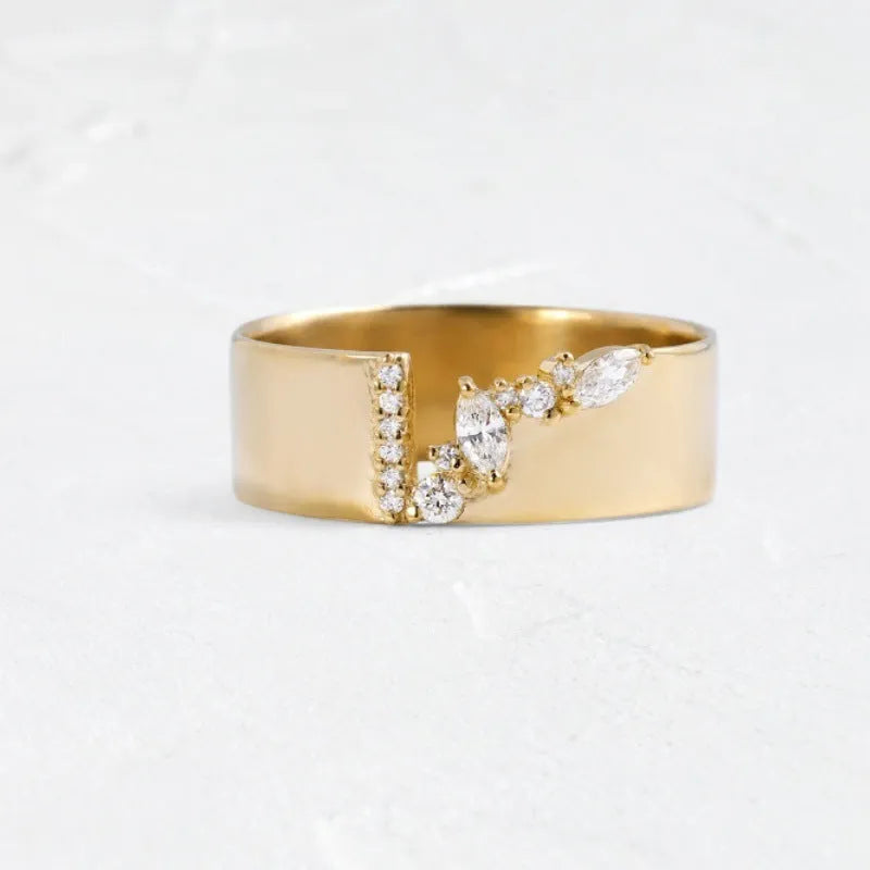 Gold-coloured women's fashion ring with shining zircon stones on a metal band