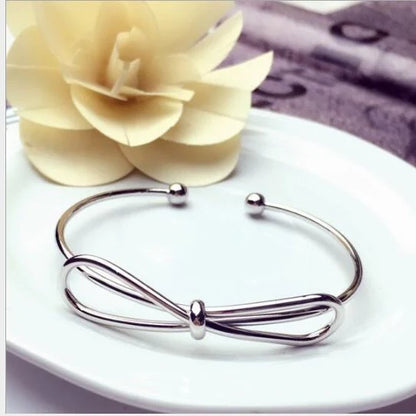 Knotted Knot O-Type Metal Openwork Bracelet in various colours, showcasing unique openwork design