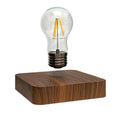 Self-rotating wireless powered maglev bulb with warm yellow light on a compact ABS base
