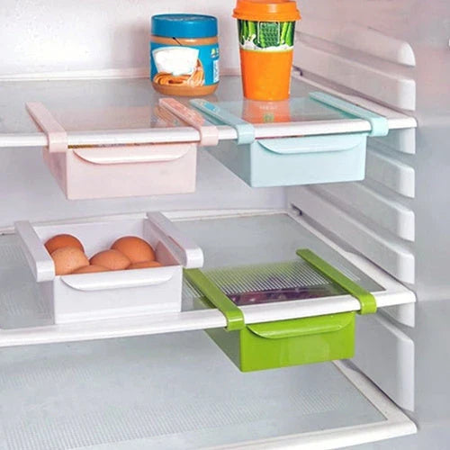 A versatile fridge organiser made of durable plastic with a clever drawer design for easy storage and access in the kitchen.