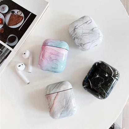 White marble pattern AirPods protective case with hard PC construction showing charging port access
