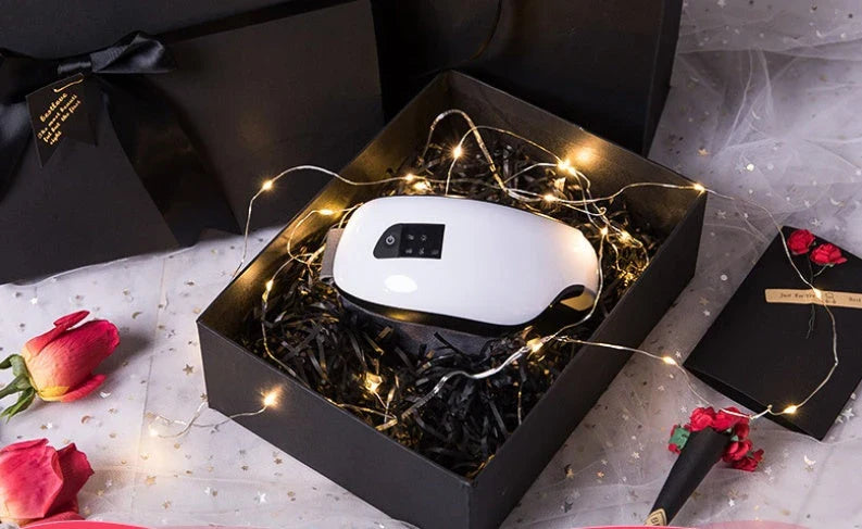 Bluetooth Music Eye Massager with air pressure and hot compress features in a compact leather case