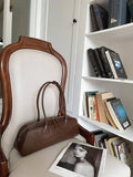 Women's genuine leather first layer cowhide oval single-shoulder bag in Brownie Brown colour with sewing thread detailing