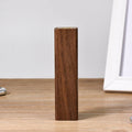 Black walnut wood portable power bank showing wooden casing with USB port and dimensions of 100mm x 25mm x 25mm