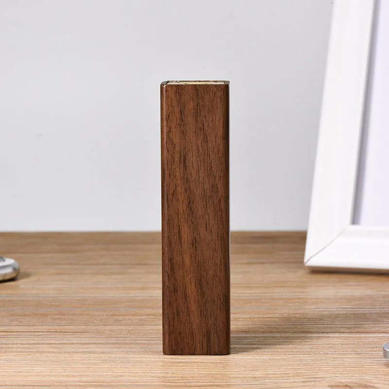 Black walnut wood portable power bank showing wooden casing with USB port and dimensions of 100mm x 25mm x 25mm