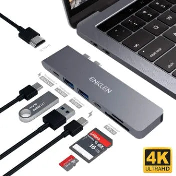 Silver aluminium USB-C hub adapter with SD card slot, HDMI, USB ports, and Thunderbolt 3