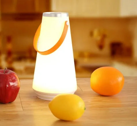 White rechargeable LED bedside lamp with warm light and adjustable brightness settings