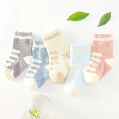 Children's cotton tube socks in jacquard construction showing colour options including blue, khaki, navy, pink, stripes, and watermelon red