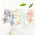 Children's cotton tube socks in jacquard construction showing colour options including blue, khaki, navy, pink, stripes, and watermelon red