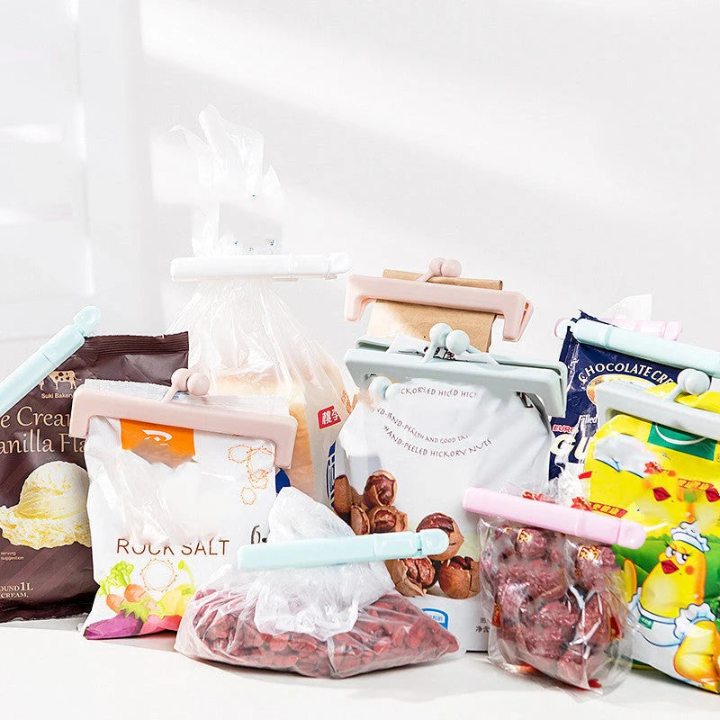 Push-button plain food bag sealing clips in blue and pink