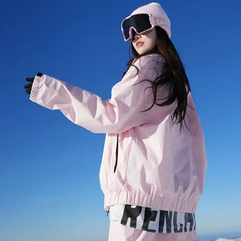 Winter waterproof ski suit set with jacket and trousers in cotton blend fabric, available in pink or black colours