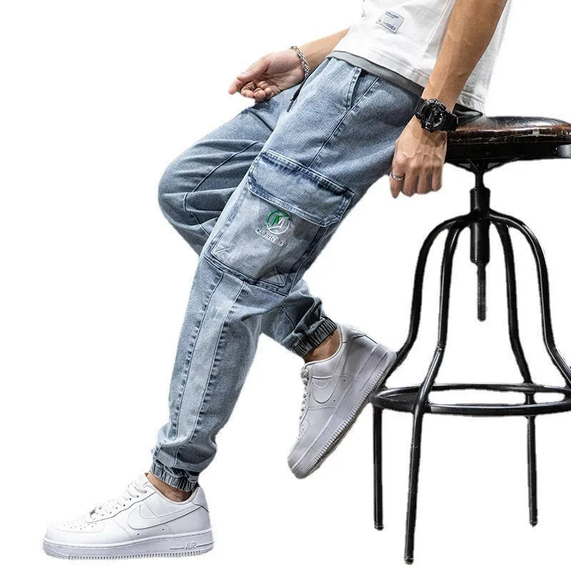 Men's loose fit cargo casual jeans in blue, showing straight leg and Korean style design.