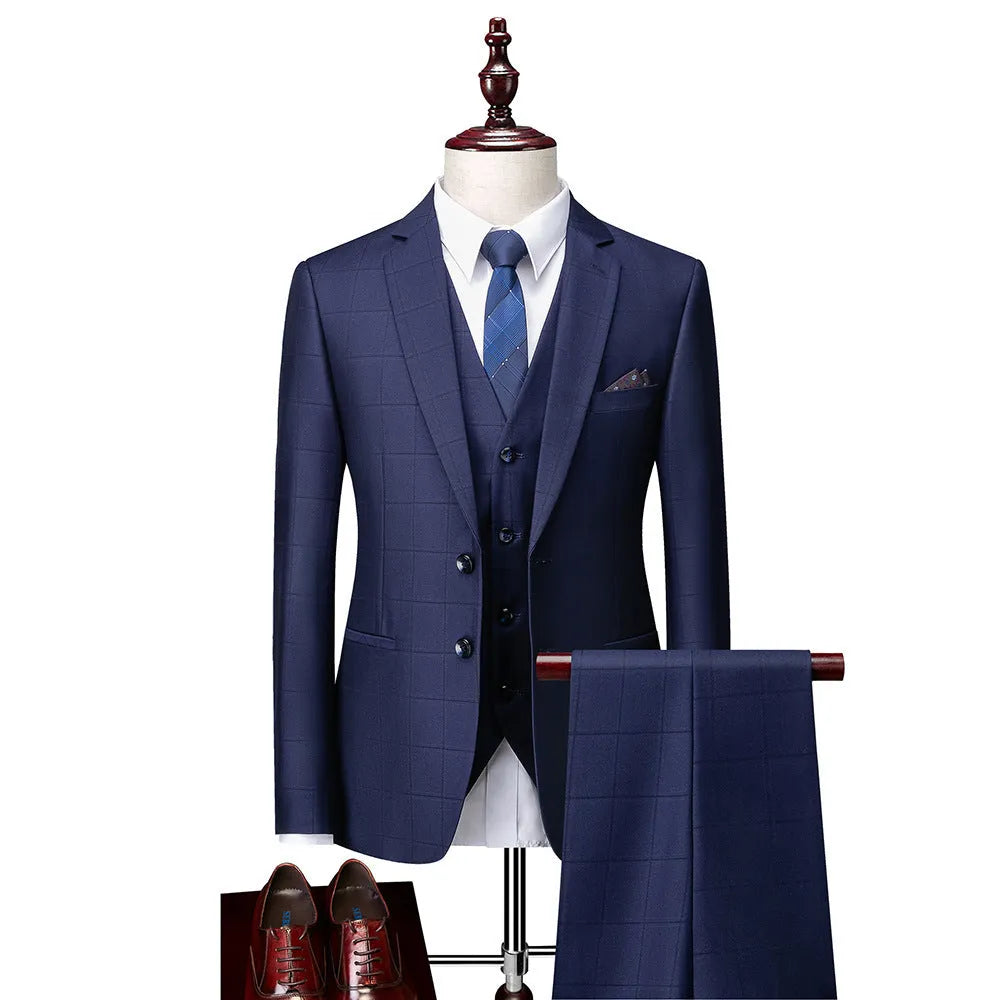 Men's navy blue plaid slim fit three-piece suit featuring a vest, jacket, and trousers on a hanger.