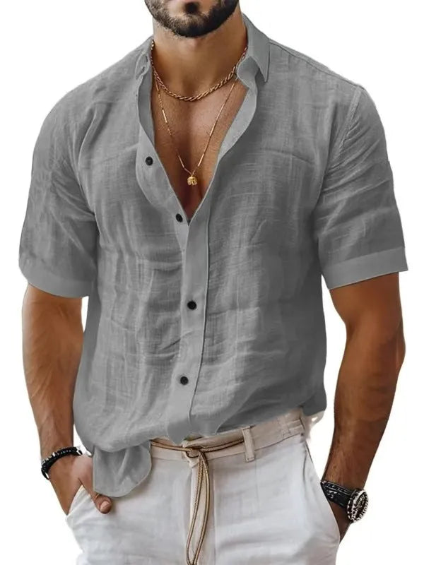Men's solid colour short sleeve lapel shirt in a cotton linen blend fabric on a hanger.