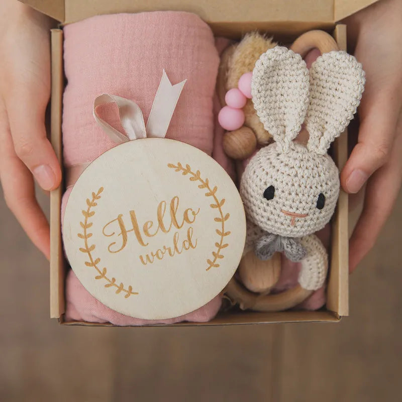 Newborn baby shower toy set with 6 bath toys in peach, blue, and brown from wood and chemical fibre