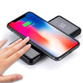Multifunctional mirror wireless charger with silver mirror finish and built-in lithium battery on a wooden desk.