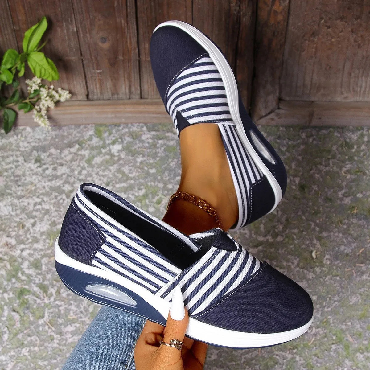 Striped canvas casual women's shoes with round head, low-top upper, and flat platform heel in blue and red.