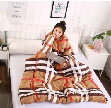 Cozy fleece-lined blanket with sleeves in various colors and designs, providing warmth and comfort for cold weather use.