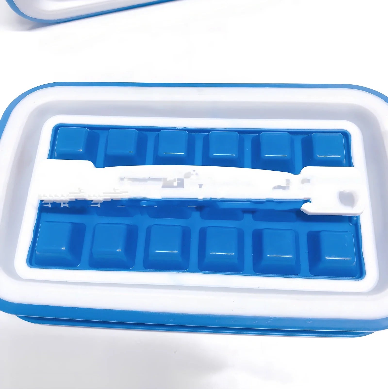 Blue silicone ice cube tray with 36 compartments making slow-melting 25mm cubes for cocktails