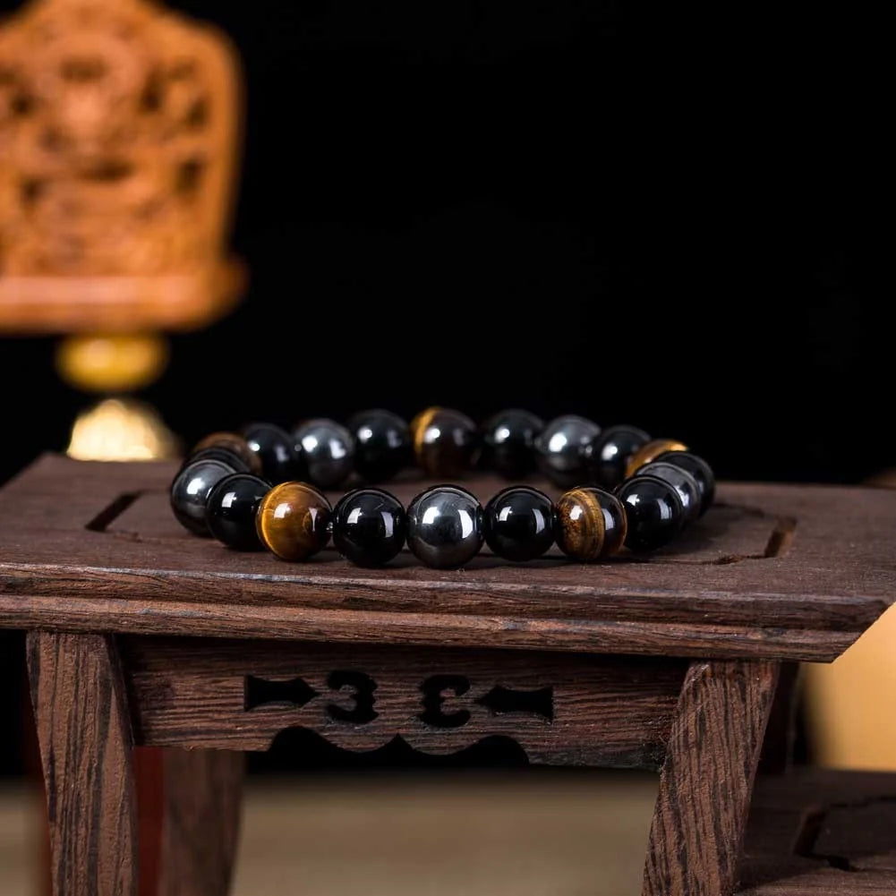Hand-woven tiger eye stone bracelet in natural colours, showcasing unique texture and geometric design.