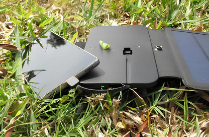 8W folding solar charger with expanded monocrystalline panel showing USB output port