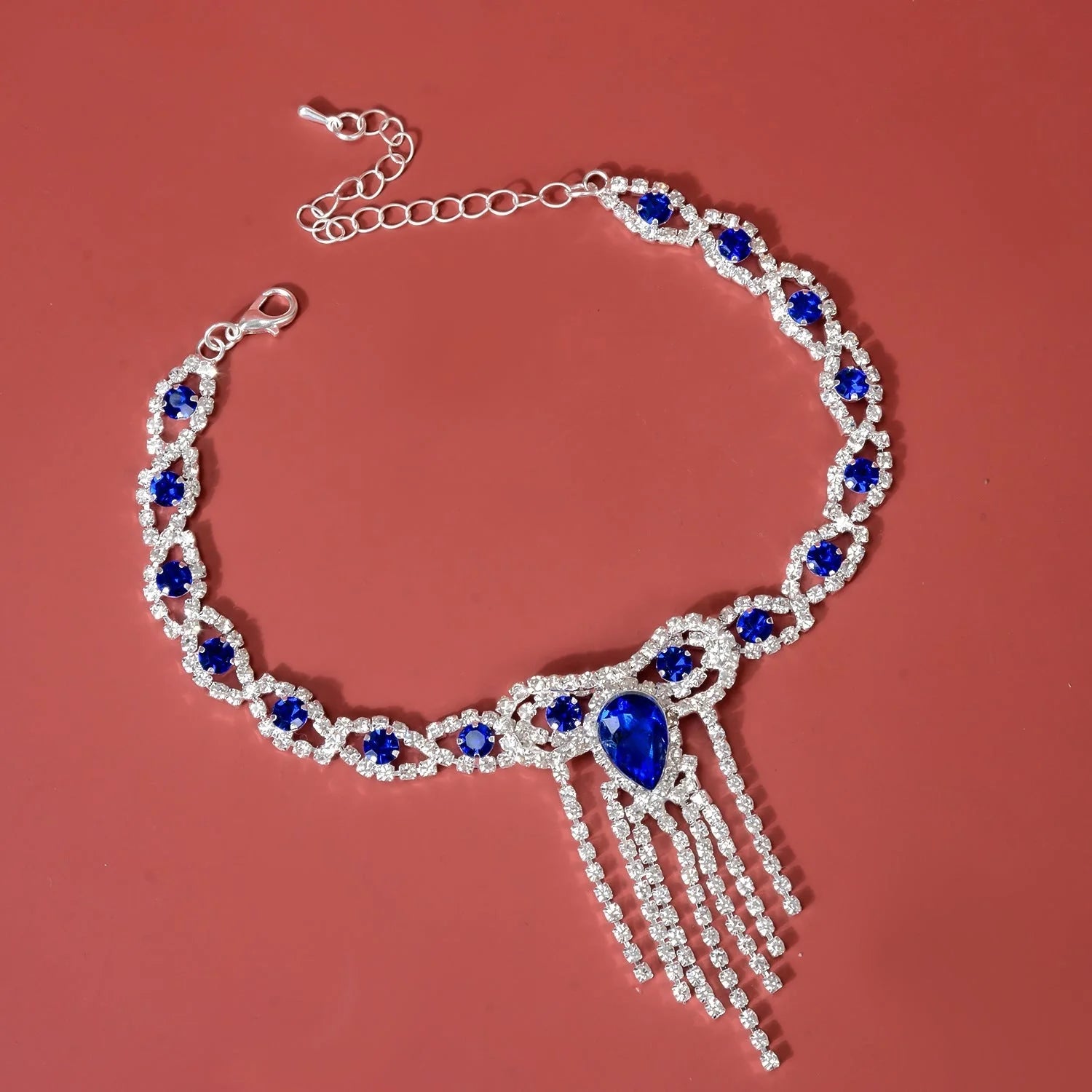 Blue rhinestone tassel anklet with gold-plated accents and semi-precious stones