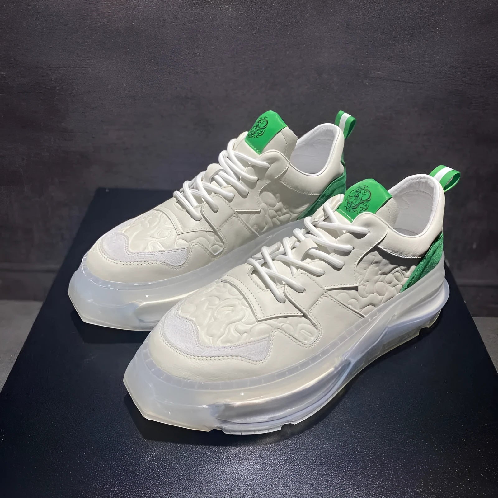 White men's air cushion dad shoes with cowhide upper, rubber sole, and lace-up closure