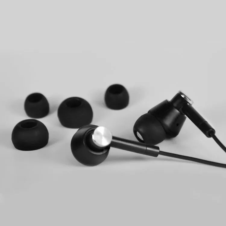 Black and white in-ear earphones with wired connection and subwoofer for computer and mobile phone use