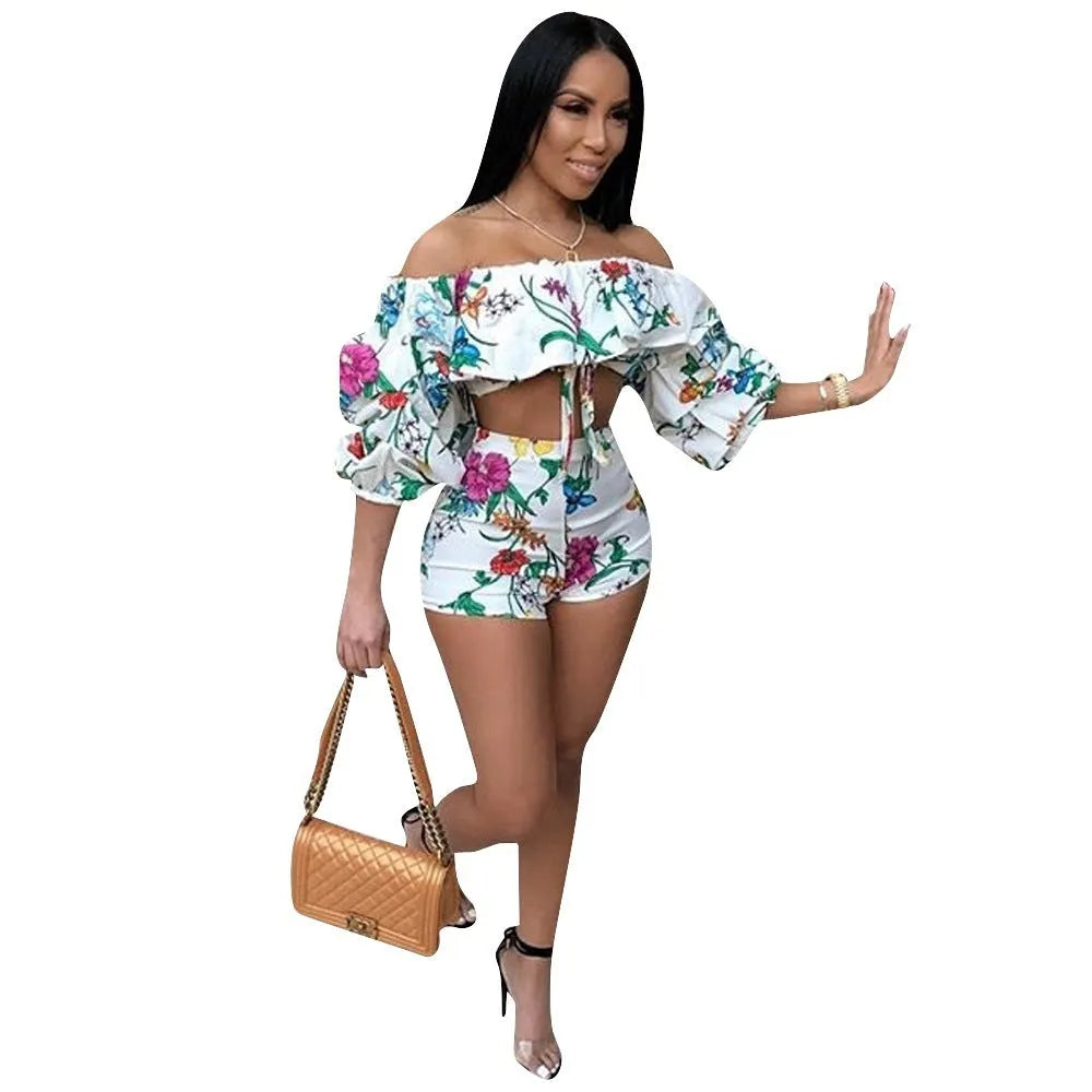 Women's multicolour digital print two-piece playsuit with fluffy pile sleeves and matching shorts.