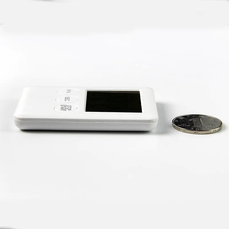Black and white kitchen timer with LCD display and magnetic back for cooking
