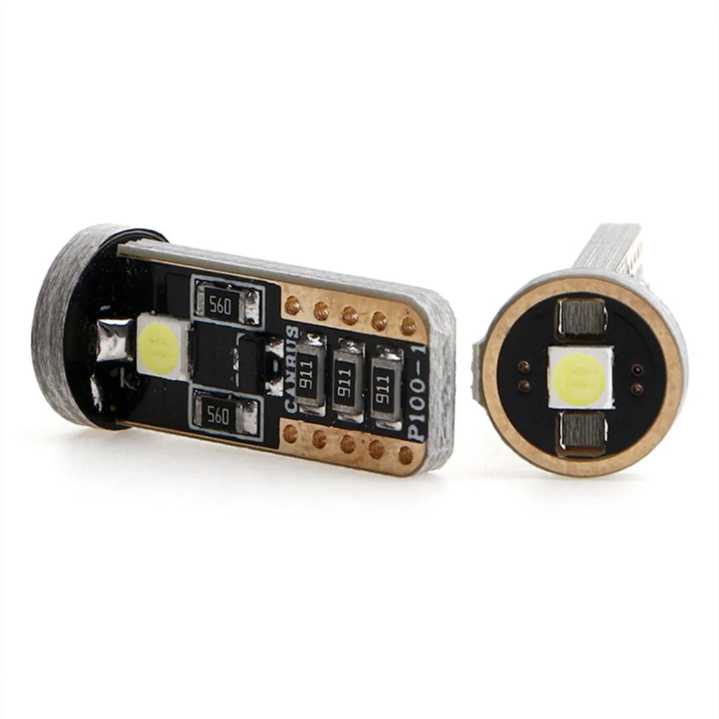 Single T10 W5W LED car interior light bulb with bright white LEDs on a dark board.