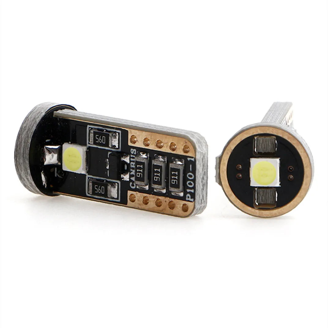 Single T10 W5W LED car interior light bulb with bright white LEDs on a dark board.