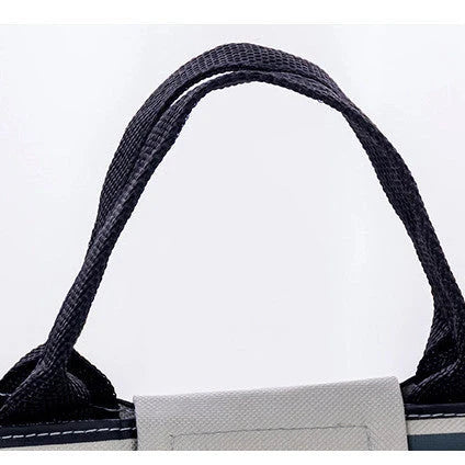 Insulated picnic mini handbag in yellow, light grey, dark grey, and navy blue with cartoon design