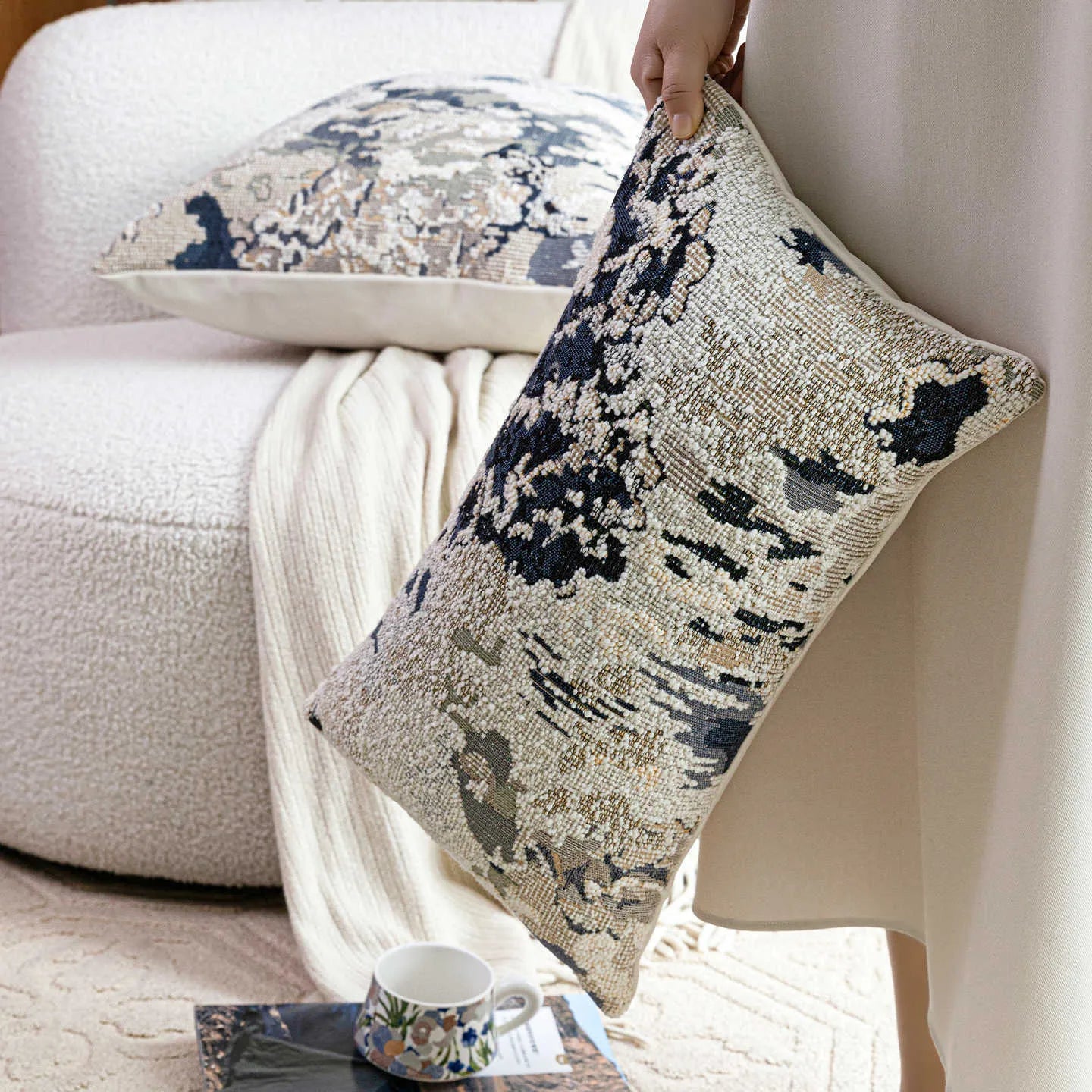Antique blue decorative pillow with floral plant pattern, shown in square and waist pillow sizes.