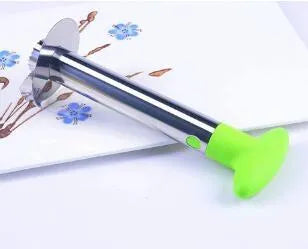 Stainless steel pineapple corer slicer with ABS handle showing cutting mechanism