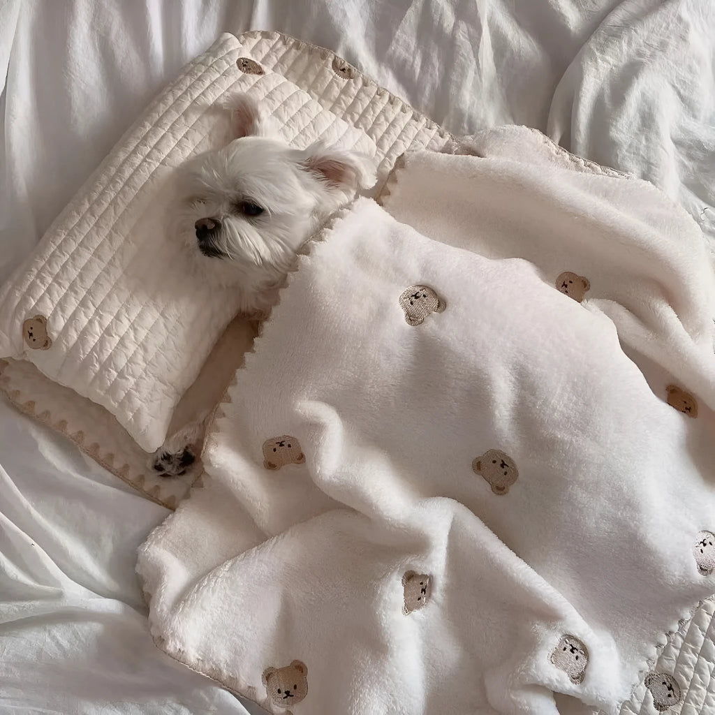 Square removable washable dog bed set with pillow, mattress, and comforter in simple bear design.