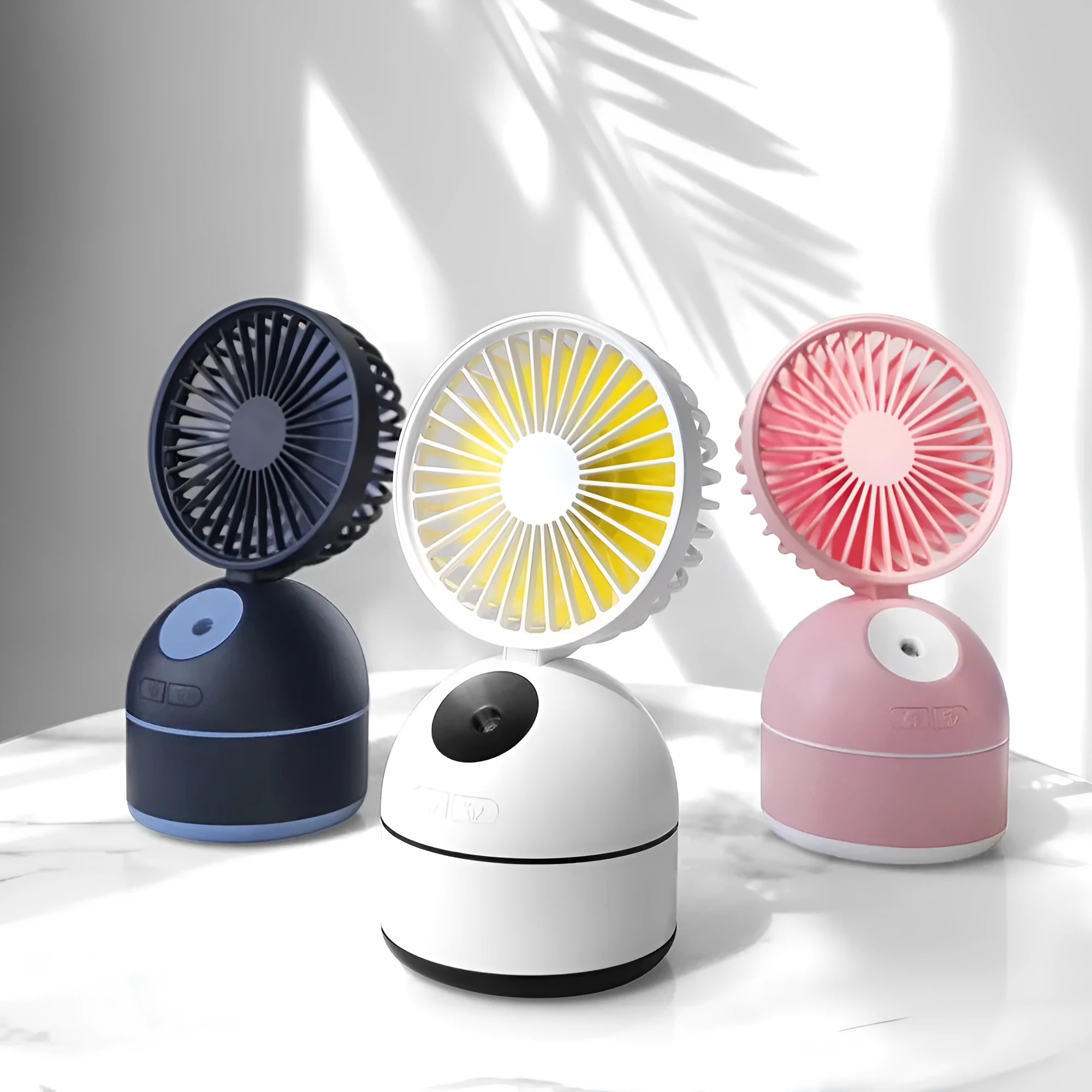Portable USB fan humidifier in white with cool mist output and integrated fan, placed on a desk